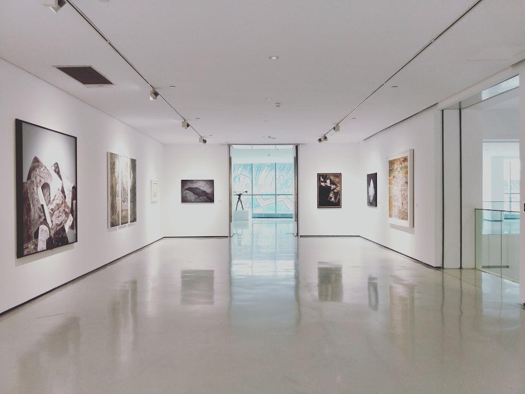 Gallery exhibition showing both digital prints and traditional paintings
